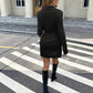 Long Sleeve Dress Fitted Waist Pleated Simplicity Short Skirt worn by a model crossing the street in chic black.